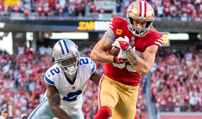 49ers tight end George Kittle evades Cowboys cornerback Jourdan Lewis on one of his three touchdowns on the night.